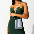 Model wearing NOIRANCA handbag Debbie in Maya Blue with a strap