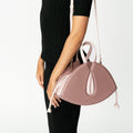 Model wearing NOIRANCA handbag Alice in Dusty Rose with a strap