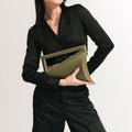 Model wearing NOIRANCA handbag Althea in Olive Green 
