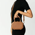 Model wearing NOIRANCA handbag Amanda in Brown with a strap