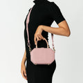 Model wearing NOIRANCA handbag Amanda in Dusty Rose with a strap