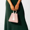 Model holding NOIRANCA handbag Grace Mini in Dusty Rose