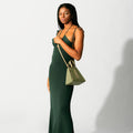 Model wearing NOIRANCA handbag Grace Mini in Olive Green with a strap
