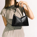 Model wearing NOIRANCA handbag Miriam in Black